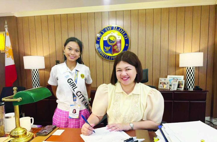 PEOPLE-CENTERED HOUSING: Treñas admin institutionalizes comprehensive housing program through Pasilong Code TOWARD A MORE HOLISTIC HOUSING SOLUTION. Iloilo City’s Mayor Raisa S. Treñas signs the PASILONG Code, with Girl Mayor Alexa Jaci L. Bataan of the University of the Philippines High School-Iloilo. The code institutionalizes the city’s housing program, which goes beyond providing homes to building safer, more sustainable communities with better opportunities for Ilonggo families.