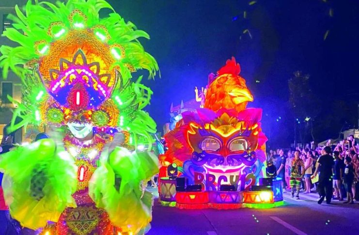 MASSKARA’S GRAND WEEKEND: Smiles, love take center stage ILLUMINATED CELEBRATION. The Chicken Inasal and San Juan float of Barangay 12 shines brightly during the Electric MassKara and Mega Float Parade at the Megaworld The Upper East in Bacolod City on Friday night, October 16. Six barangay floats and seven sponsor floats participated in this highlight event, which is one of the centerpiece attractions of the MassKara Festival 2026. CESAR JOLITO III PHOTO