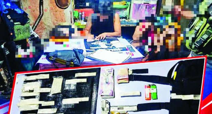 estancia_drug_bust.JPG_resized Authorities mark confiscated plastic sachets of suspected shabu and unlicensed .9mm firearm following a joint anti-illegal drug operation in Barangay Botongon, Estancia, Iloilo on September 29, 2026. Eight suspects are now in the custody of the Estancia police station for proper disposition. IPPO PHOTO