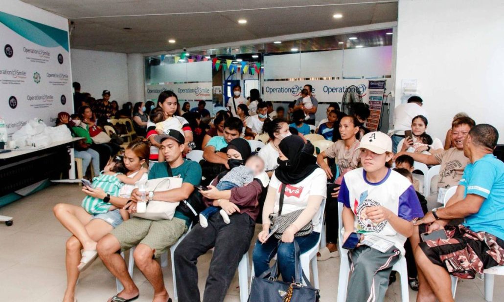 Families line up for screening during the Watsons Philippines and Operation Smile Philippines medical mission at Cebu City Medical Center, where each child’s needs are assessed to determine the appropriate care.
