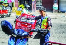 WAGE HIKE BACKLASH: PCCI warns of layoffs, business closures A rider sorts parcels for delivery in Iloilo City’s City Proper district. The Philippine Chamber of Commerce and Industry Iloilo warns that the Regional Tripartite Wages and Productivity Board’s newly approved P40 to P45 daily minimum wage increase could trigger job cutbacks and business closures among struggling micro, small and medium enterprises across Western Visayas. ALLEN ANIMAS/PN
