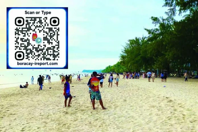 mai_Boracay_police1_copy_compressed_resized To easily alert the police in Boracay Island, the Malay, Aklan Municipal Police Station launched BORACAY iREPORT, a browser-based platform that allows residents, workers, business owners and visitors to alert authorities without downloading an application or creating an account. Users only need to scan a designated QR code (inset) using a mobile phone, tablet or computer to access the system. Photo shows tourists milling on Boracay’s white-sand shores. PHOTO FROM X
