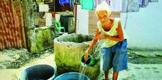 A resident collects water form a shallow well for household use. Iloilo City intensifies its monitoring of wells amid preparations for a severe El Niño. Authorities warn that some water sources remain contaminated despite chlorination, posing potential health risks to families relying on groundwater. ALLEN ANIMAS/PN
