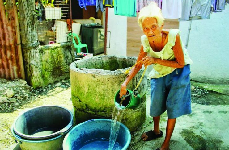 WELLS FAIL SAFETY TESTS; Several shallow wells remain contaminated despite chlorination as El Niño threatens city water supply A resident collects water form a shallow well for household use. Iloilo City intensifies its monitoring of wells amid preparations for a severe El Niño. Authorities warn that some water sources remain contaminated despite chlorination, posing potential health risks to families relying on groundwater. ALLEN ANIMAS/PN