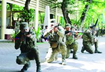 1,300 Iloilo reservists bolster disaster, defense readiness READY TO DEFEND, PREPARED TO RESPOND. Philippine Army reservists stand in formation and demonstrate tactical combat capabilities during the grand mustering at Iloilo Science and Technology University in La Paz, Iloilo City, on July 5, 2026. The gathering of nearly 1,300 citizen-soldiers underscored the vital role of the military reserve force in strengthening territorial defense, disaster response and emergency preparedness across Iloilo. AJ PALCULLO/PN
