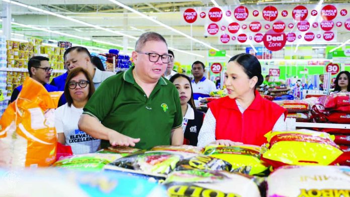 Agriculture Secretary Francisco P. Tiu Laurel Jr. and Trade Secretary Ma. Cristina A. Roque lead the Special Joint Market Monitoring at a supermarket in Cubao, Quezon City. The Department of Trade and Industry says there are no requests for price hikes yet from manufacturers and no indication of price increases due to El Niño. DEPARTMENT OF AGRICULTURE PHOTO