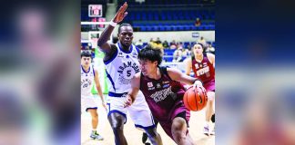 University of the Philippines Fighting Maroons’ Veejay Pre dribbles past Adamson University Soaring Falcons’ Precious Jonah during their UAAP Season 89 men’s basketball encounter at the Smart Araneta Coliseum. UAAP