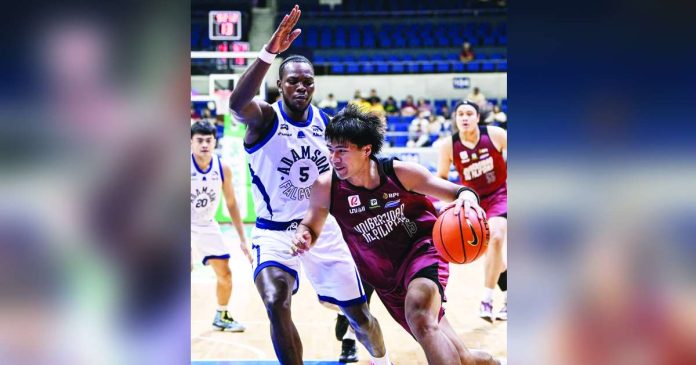 sports UP copy_superimposed University of the Philippines Fighting Maroons’ Veejay Pre dribbles past Adamson University Soaring Falcons’ Precious Jonah during their UAAP Season 89 men’s basketball encounter at the Smart Araneta Coliseum. UAAP