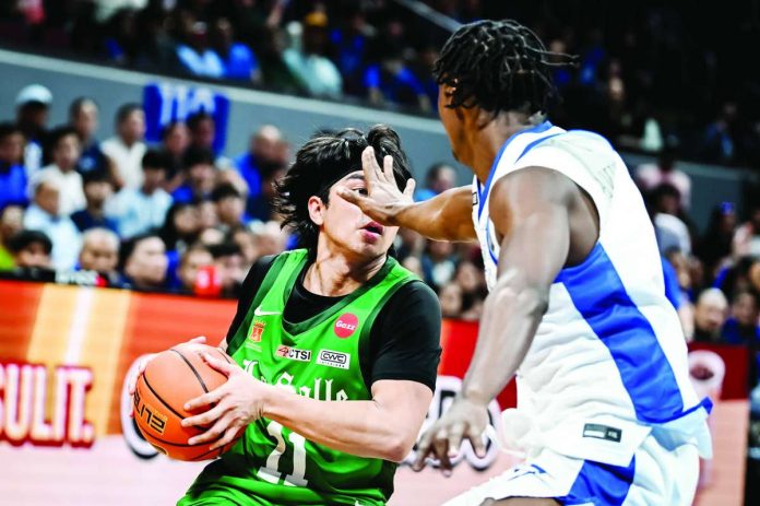 sports_DLSU_compressed_resized De La Salle University Green Archers guard Jacob Cortez looks for an open teammate while being defended by Ateneo de Manila University Blue Eagles’ EJ Kapihe during their UAAP Season 89 men’s basketball rivalry showdown at the SM Mall of Asia Arena in Pasay City. UAAP