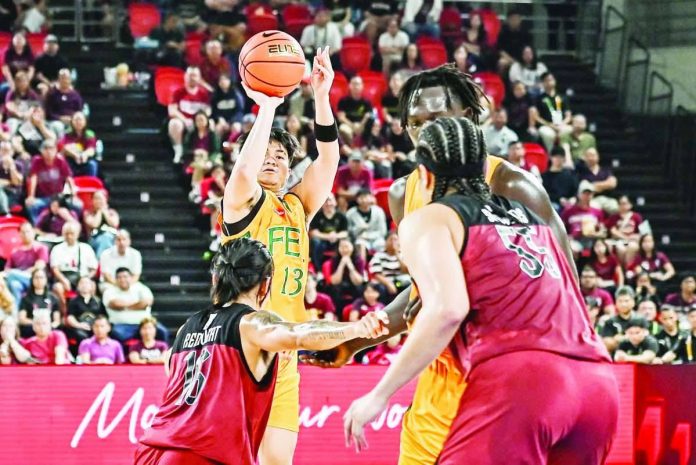 sports_FEU_compressed_resized Far Eastern University Tamaraws guard Janrey Pasaol pulls up for a shot against University of the Philippines Fighting Maroons defender Rey Remogat during their UAAP Season 89 men’s basketball game. UAAP