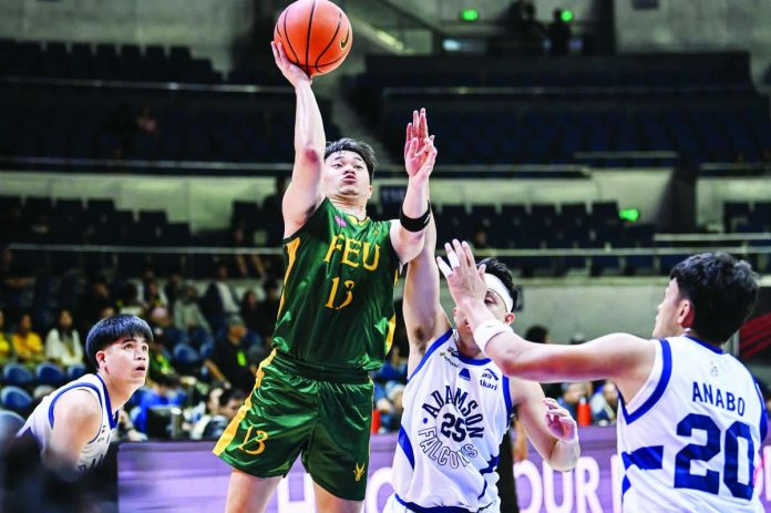 sports_FEU_copy_compressed_resized Far Eastern University Tamaraws’ Janrey Pasaol attempts a one-handed shot against Adamson University during their UAAP Season 89 men’s basketball encounter at the Smart Araneta Coliseum. FEU snapped a three-game losing streak with a 73-66 victory to bolster its Final Four aspirations. UAAP