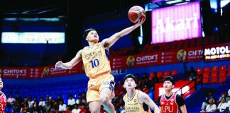 Jose Rizal University Heavy Bombers’ Lawrence Mangubat soars for a layup during their NCAA Season 102 men’s basketball campaign. Returning from a shoulder injury, Mangubat sank two crucial free throws in the closing seconds to help JRU escape Lyceum, 81-78, and seize solo leadership of Group A. NCAA