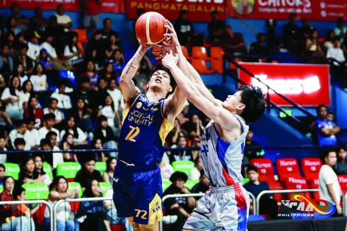 Jose Rizal University Heavy Bombers’ Chris Hubilla battles through the defense of the Arellano University Chiefs during their NCAA Season 102 men’s basketball encounter. NCAA