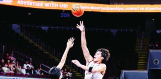 University of the Philippines Fighting Maroons’ Veejay Pre scores on a one-hander against the defense of University of Santo Tomas Growling Tigers’ Charles Esteban during their UAAP Season 89 men’s basketball encounter. UAAP