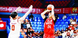 San Beda University Red Lions’ Aldous Torculas pulls up for a shot against the defense of University of Perpetual Help Altas’ Rey Maglupay during their NCAA Season 102 men’s basketball encounter at the Playtime Filoil Centre in San Juan. NCAA