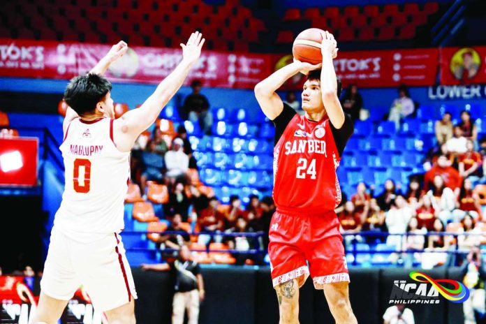 sports_Puno_copy_compressed_resized San Beda University Red Lions’ Aldous Torculas pulls up for a shot against the defense of University of Perpetual Help Altas’ Rey Maglupay during their NCAA Season 102 men’s basketball encounter at the Playtime Filoil Centre in San Juan. NCAA