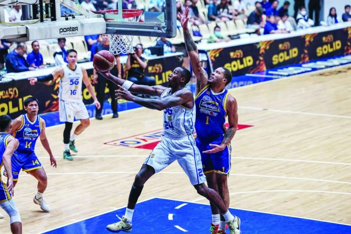 TNT Tropang 5G import Rondae Hollis-Jefferson attacks the basket against Magnolia Chicken Timplados Hotshots defender KJ Buffen during Game 1 of their PBA Governors’ Cup quarterfinal series. PBA