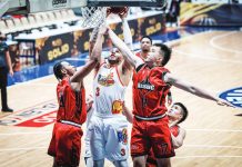 Rain or Shine Elasto Painters' Aaron Fuller scores against the defense of Blackwater Bossing's Kentrell Barkley and Cyrus Austria during their PBA Season 50 Governors' Cup encounter. PBA