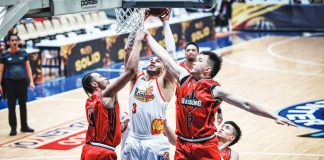 Rain or Shine Elasto Painters' Aaron Fuller scores against the defense of Blackwater Bossing's Kentrell Barkley and Cyrus Austria during their PBA Season 50 Governors' Cup encounter. PBA