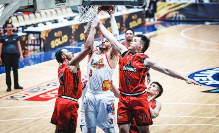 sports_Rain_resized Rain or Shine Elasto Painters' Aaron Fuller scores against the defense of Blackwater Bossing's Kentrell Barkley and Cyrus Austria during their PBA Season 50 Governors' Cup encounter. PBA
