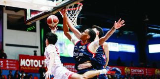 San Beda University Red Lions’ Aldous Torculas is forced into a tough shot by Colegio de San Juan de Letran Knights defender Denzil Walker during their NCAA Season 102 men’s basketball showdown. NCAA