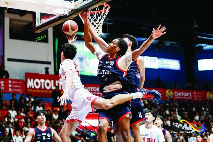 sports_Torculas_compressed_resized San Beda University Red Lions’ Aldous Torculas is forced into a tough shot by Colegio de San Juan de Letran Knights defender Denzil Walker during their NCAA Season 102 men’s basketball showdown. NCAA