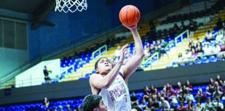 University of the Philippines Fighting Maroons center Gani Stevens attacks the basket for an inside conversion during their 101-70 rout of the University of the East Red Warriors in the UAAP Season 89 men’s basketball tournament.