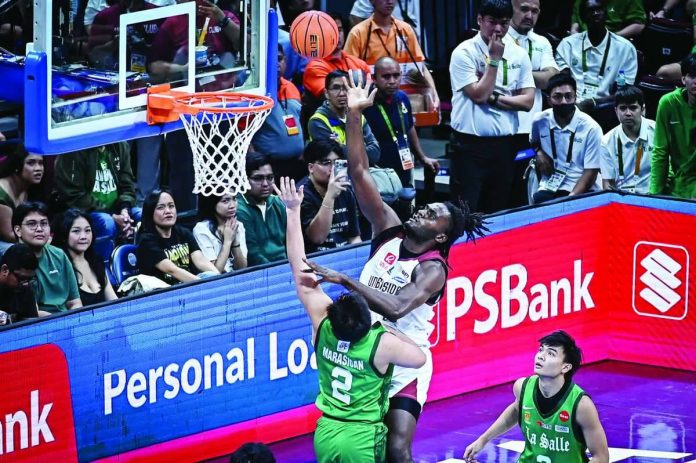 sports_UP_compressed_resized University of the Philippines Fighting Maroons’ Kingsly Udodo attacks the defense of De La Salle University Green Archers for an inside basket during their UAAP Season 89 men’s basketball clash at the SM Mall of Asia Arena. UAAP