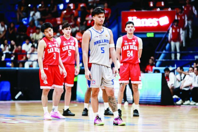 sports_Valencia_compressed_resized Arellano University Chiefs’ Sebastian Valencia delivers the game-winning basket with 13 seconds remaining to seal a thrilling 56-55 victory over San Beda University Red Lions in the NCAA Season 102 men’s basketball tournament. NCAA