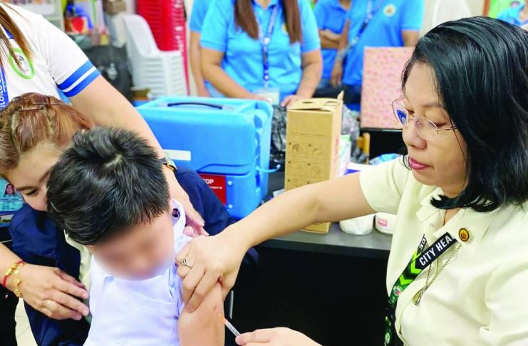 MISINFORMATION STALLS VAX DRIVE; Iloilo City races to close immunization gap with new drive Health workers inoculate children during a school-based immunization drive in Iloilo City. The CHO is mounting an expanded School-Based Immunization program running from October 19 to December 13, 2026, aiming to reverse last year's low turnout among Grade 1 and Grade 7 students and counter social media misinformation. ILOILO CITY HEALTH OFFICE PHOTO